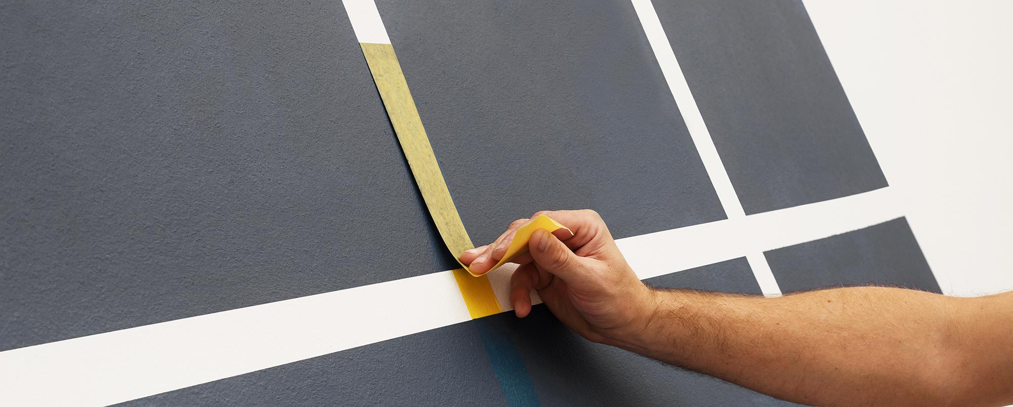 Masq painters tape being removed